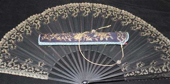A lacquered fan in case